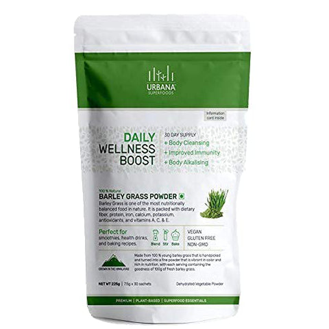 An image depicting Urbana Superfoods Daily Wellness Boost Barley Grass Powder pouch. The white and green pack highlights benefits such as body cleansing, improved immunity, and body alkalising. Labels mention vegan, gluten-free, and non-GMO products perfect for smoothies, health drinks, and baking recipes.