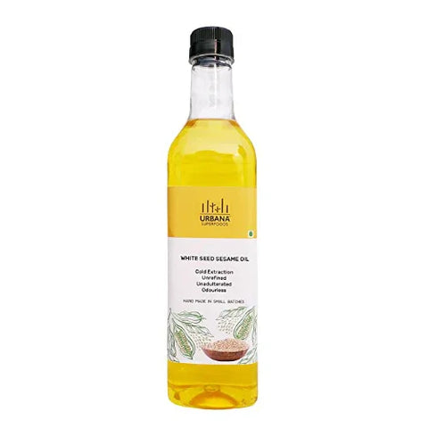 An image depicting a bottle of Urbana Superfoods White Seed Sesame Oil, filled with golden cold-pressed oil, featuring a clean yellow label with sesame illustrations, representing purity, nutrition, and handcrafted extraction.