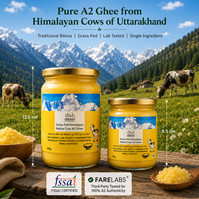 Two jars of Himalayan A2 Ghee displayed on a rustic wooden surface with a backdrop of cows in a mountain meadow. The image includes dimension markers (12.