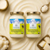 Two jars of grass-fed Himalayan native buffalo ghee with a mountainous label on a beige background.