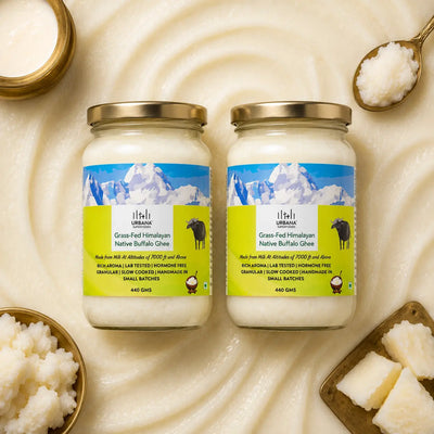 Two jars of grass-fed Himalayan native buffalo ghee with a mountainous label on a beige background.