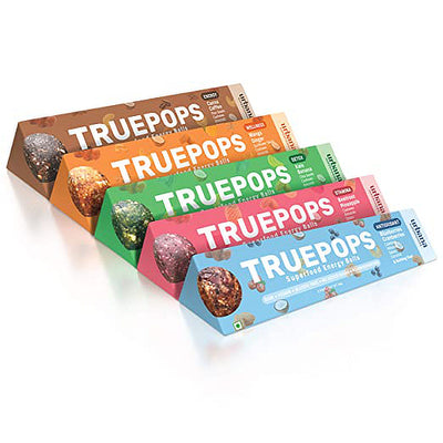 An image depicting a colourful lineup of Urbana Superfoods Truepops superfood energy balls in assorted flavours, Coffee Cocoa, Kale Banana, Mango Ginger, Beetroot Pineapple, and Berry Blend, representing healthy snacking and natural nutrition in vibrant packaging.